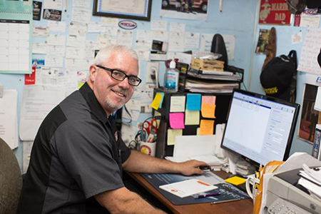 Ted Curran in the office | Monkey Wrenches Inc